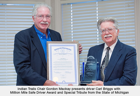 Indian Trails Chair Gordon Mackay presents driver Carl Briggs with Million Mile Safe Driver Award and Special Tribute from the State of Michigan